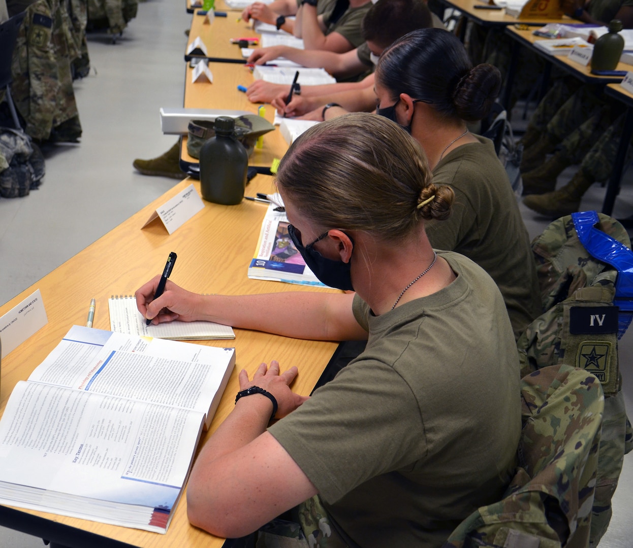 Students in the Combat Medic Specialist Training Program, or CMSTP, second training shift take notes during a lecture in the Emergency Medical Technician course.