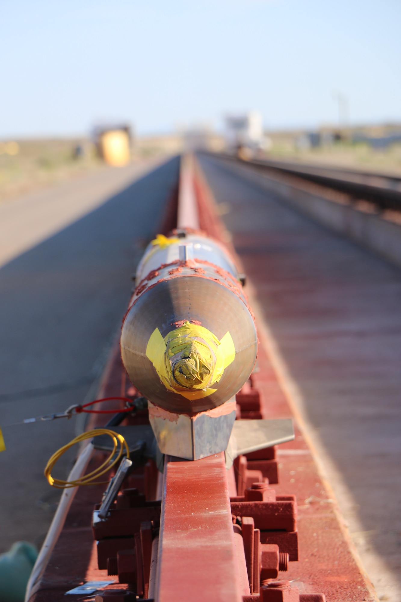 A rocket sled is shown just before launch on the Holloman High Speed Test Track at Holloman Air Force Base, New Mexico. The 9-inch monorail sled was launched as part of the Hypersonic Readiness program, which is a series of tests being conducted by the 846th Test Squadron at Holloman to prepare for future rocket sled testing to support programs and projects including the Hypersonic Test and Evaluation Investment Portfolio and the Air-Launched Rapid Response Weapon, as well as hypersonic sled tests for other customers. (U.S. Air Force photo)