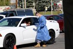 Soldiers and Airmen from the Wisconsin National Guard collect specimens for COVID-19 testing Oct. 7, 2020, at a community-based testing site in Milwaukee. The Wisconsin National Guard has multiple COVID-19 specimen collection teams operating throughout the state.