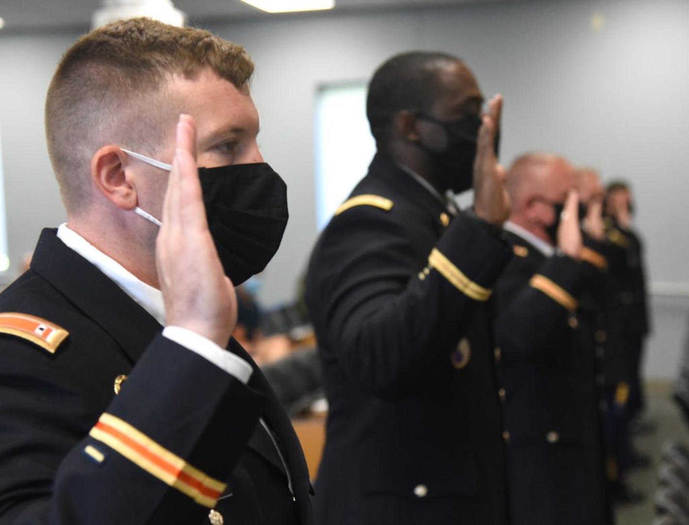 Virginia National Guard and U.S. Army Reserve candidates swear in as new warrant officers during a graduation ceremony at the conclusion of Warrant Officer Candidate School