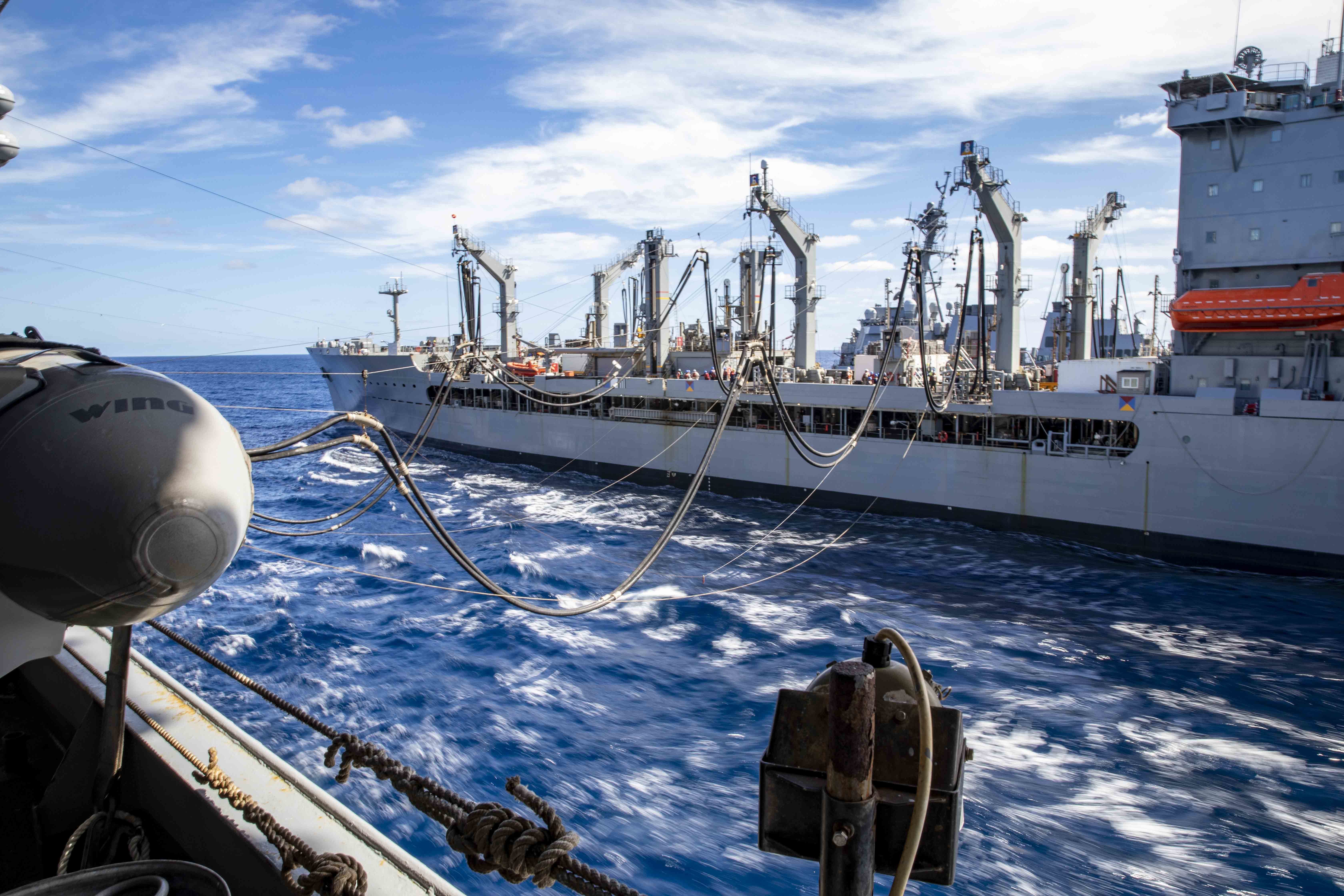 The Henry J. Kaiser-class fleet replenishment oiler USNS Kanawha (T-AO 196) conducts a replenishment-at-sea with the Wasp-class amphibious assault ship USS Iwo Jima (LHD 7), Oct. 15, 2020.