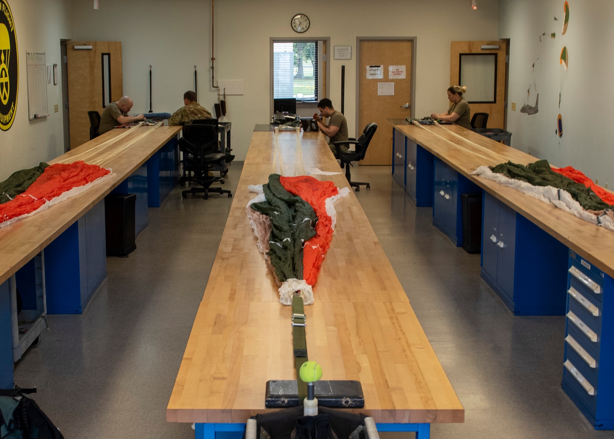 Airmen from the 4th Operations Support Squadron aircrew flight equipment complete annual inspections of parachutes and replace the Universal Water-activated Release System (UWARS) at Seymour Johnson Air Force Base, North Carolina, Sept. 8, 2020.