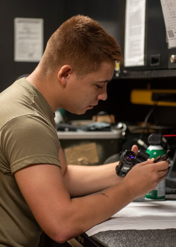 Senior Airman Airin Harmon, 4th Operations Support Squadron aircrew flight equipment journeyman, inspects night vision goggles used by F-15E Strike Eagle pilots at Seymour Johnson Air Force Base, North Carolina, Sept. 8, 2020.