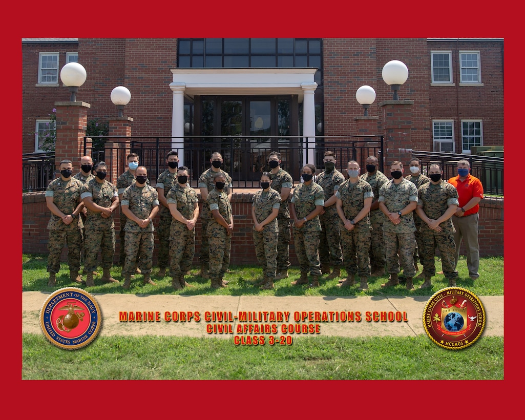 U.S. Marines and staff members with Marine Corps Civil-Military Operations School pose for a group photo at Marine Corps University, Marine Corps Base Quantico, Va., March 2020