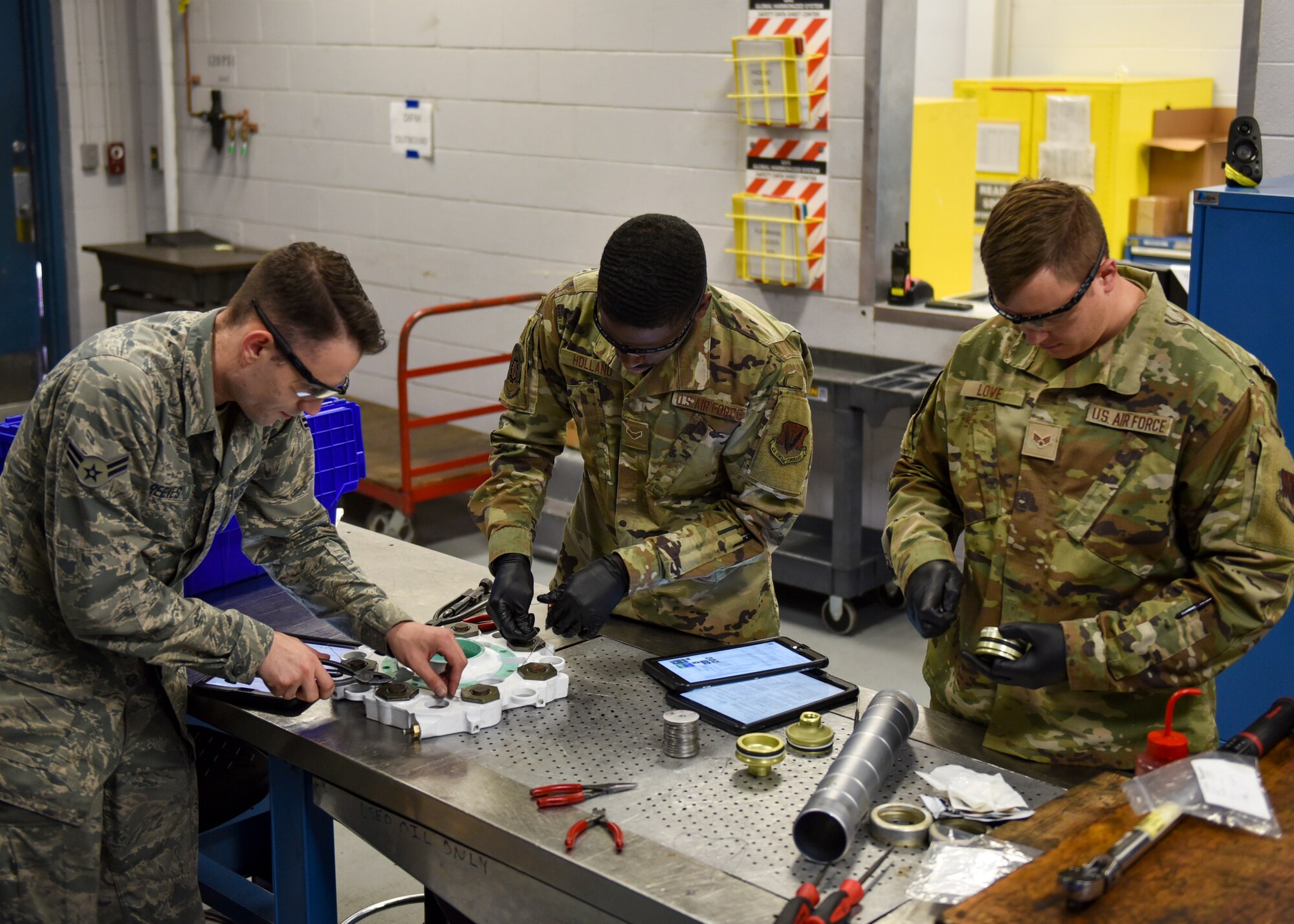 Airmen from the 4th Component Maintenance Squadron hydraulics shop safety wire the piston housing of an A-10 Thunderbolt II break and fix the jet fuel starter brake accumulator of an F-16 Fighting Falcon at Seymour Johnson Air Force Base, North Carolina, Sept. 16, 2020.
