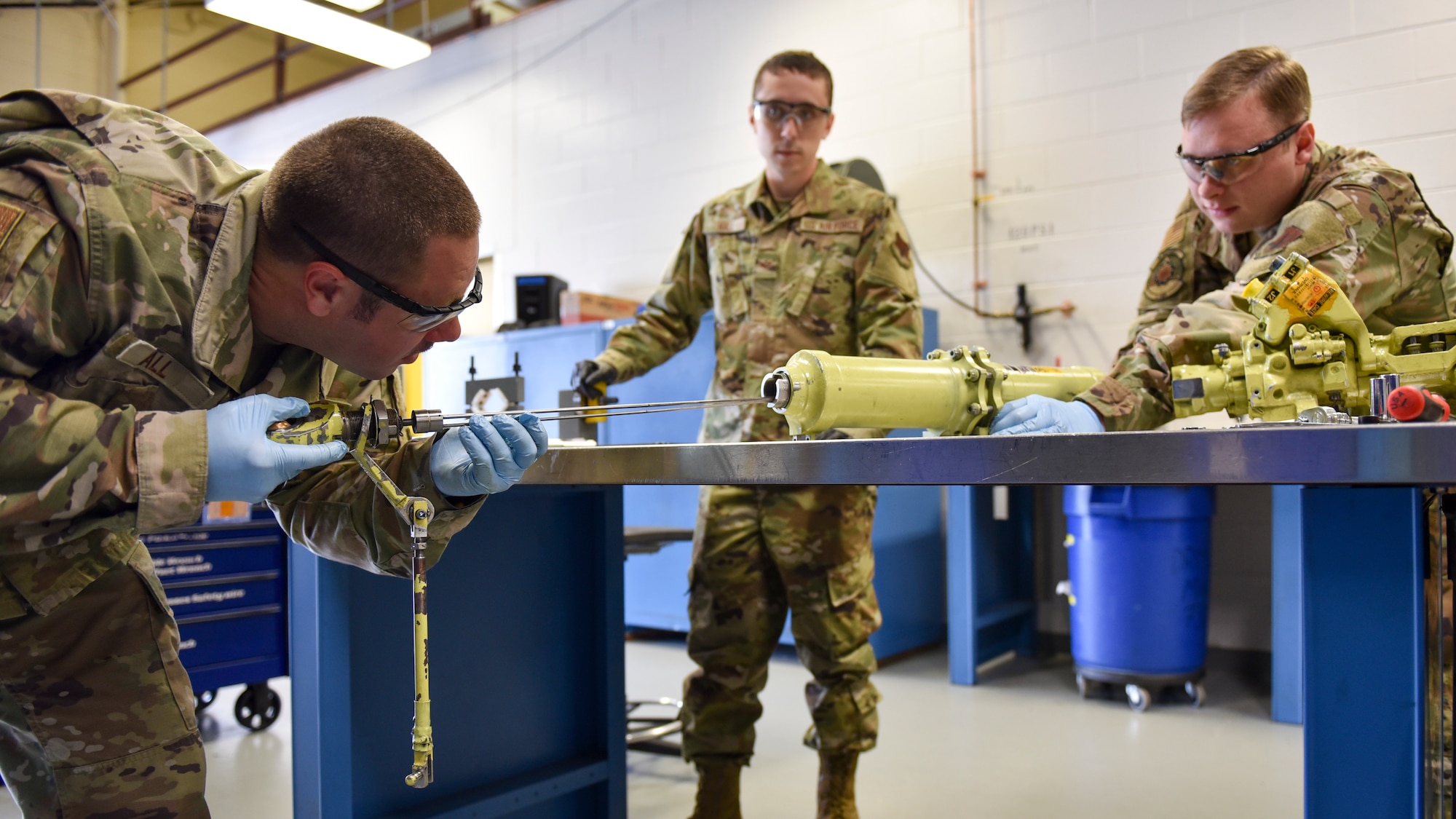 Airmen from the 4th Component Maintenance Squadron hydraulics shop work on an F-15E Strike Eagle servocylinder hydraulic stabilator actuator at Seymour Johnson Air Force Base, North Carolina, Sept. 16, 2020.