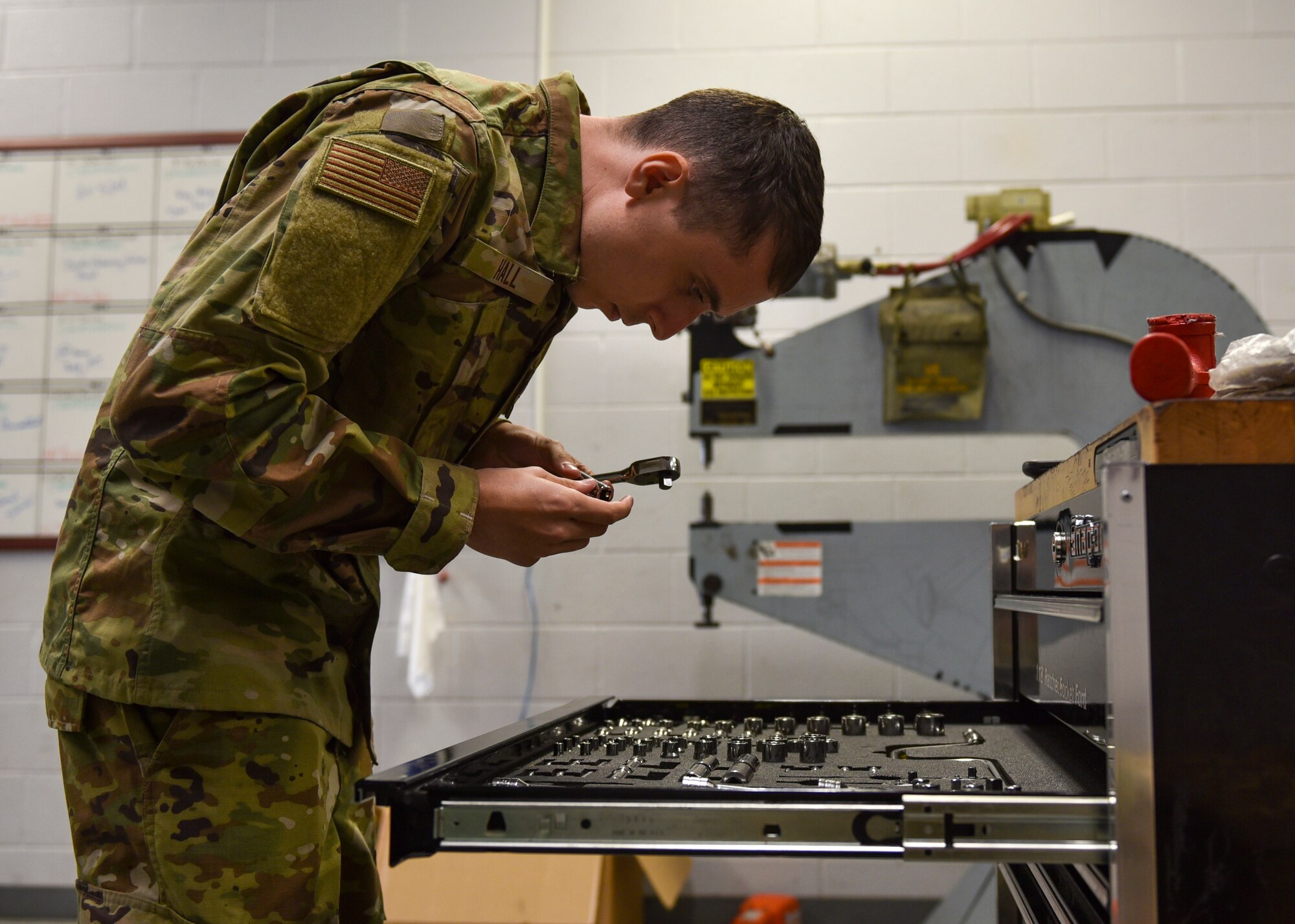 Senior Airman Kendall Hall, 4th Component Maintenance Squadron hydraulics journeyman, places tools in their designated spot in the hydraulics centralized repair facility at Seymour Johnson Air Force Base, North Carolina, Sept. 16, 2020.