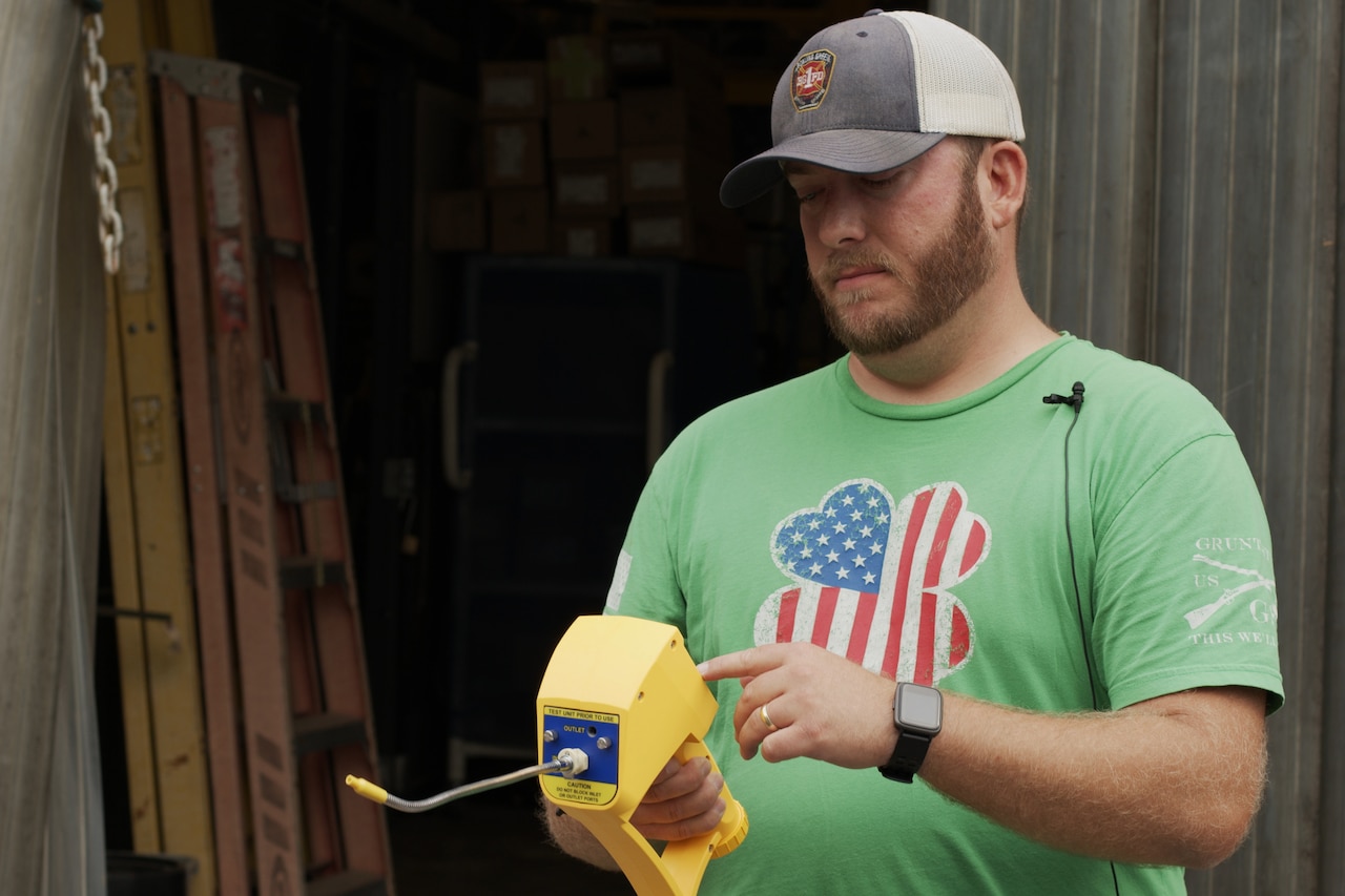 A man tests equipment.