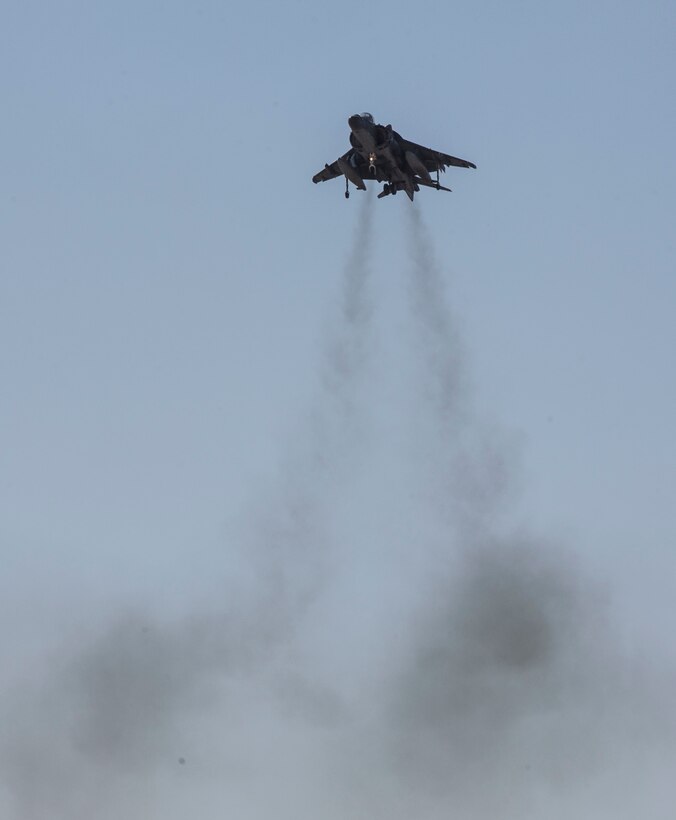 U.S. Marine Corps Lt. Col. Keith Bucklew, commanding officer of Marine Attack Squadron (VMA) 311, hovers in an AV-8B Harrier II assigned to VMA-311, Marine Aircraft Group 13, 3rd Marine Aircraft Wing, during his last flight at Marine Corps Air Station Yuma, Ariz., Oct. 14, 2020. The last flight is a significant event for every pilot and is celebrated by spraying the pilot and aircraft with water. (U.S. Marine Corps photo by Lance Cpl. Julian Elliott-Drouin)