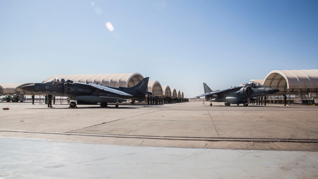 U.S. Marine Corps Col. Benjamin Hutchins, commanding officer of Marine Aircraft Group 13, and Lt. Col. Keith Bucklew, commanding officer of Marine Attack Squadron 311, stage their AV-8B Harrier IIs on the flightline during Lt. Col. Bucklew’s last flight at Marine Corps Air Station Yuma, Ariz., Oct. 14, 2020.