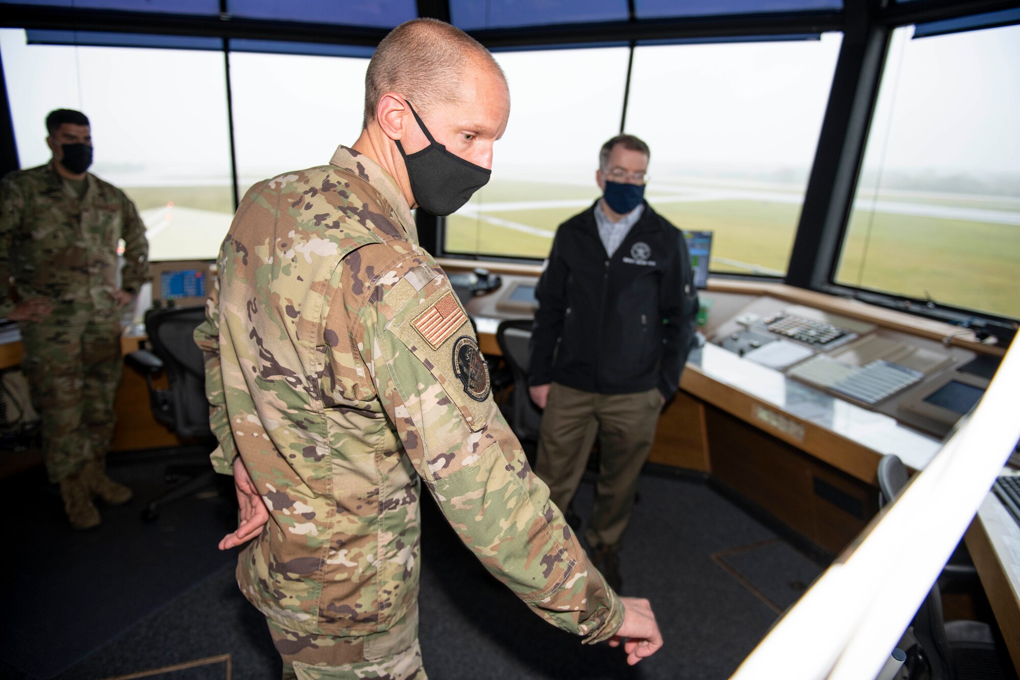 Deputy Secretary of Defense David L. Norquist, right, and U.S. Air Force Lt. Col. Joseph Knothe, front, 420th Air Base Squadron commander, discuss the runway and future construction plans at RAF Fairford, England, Oct. 12, 2020.  The RAF Fairford aircraft runway is the longest military runway in the U.K. The visit highlighted the strategic importance of RAF Fairford, oriented him to the bomber and ISR missions in support of U.S. European Command and national defense strategy, and gave him the opportunity to engage with Airmen. (U.S. Air Force photo by Senior Airman Jennifer Zima)