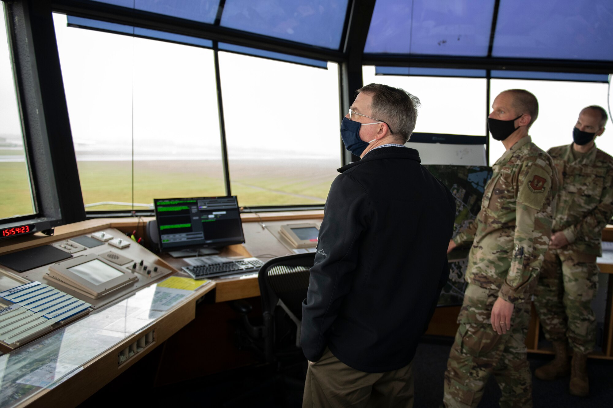 Deputy Secretary of Defense David L. Norquist, left, U.S. Air Force Lt. Col. Joseph Knothe, center, 420th Air Base Squadron commander, and Brig. Gen. Jefferson J. O'Donnell, right, U.S. European Command Senior Defense Official and Defense Attaché, discuss the runway and future construction plans at RAF Fairford, England, Oct. 12, 2020.  The RAF Fairford aircraft runway is the longest military runway in the U.K. The visit highlighted the strategic importance of RAF Fairford, oriented him to the bomber and ISR missions in support of U.S. European Command and national defense strategy, and gave him the opportunity to engage with Airmen. (U.S. Air Force photo by Senior Airman Jennifer Zima)