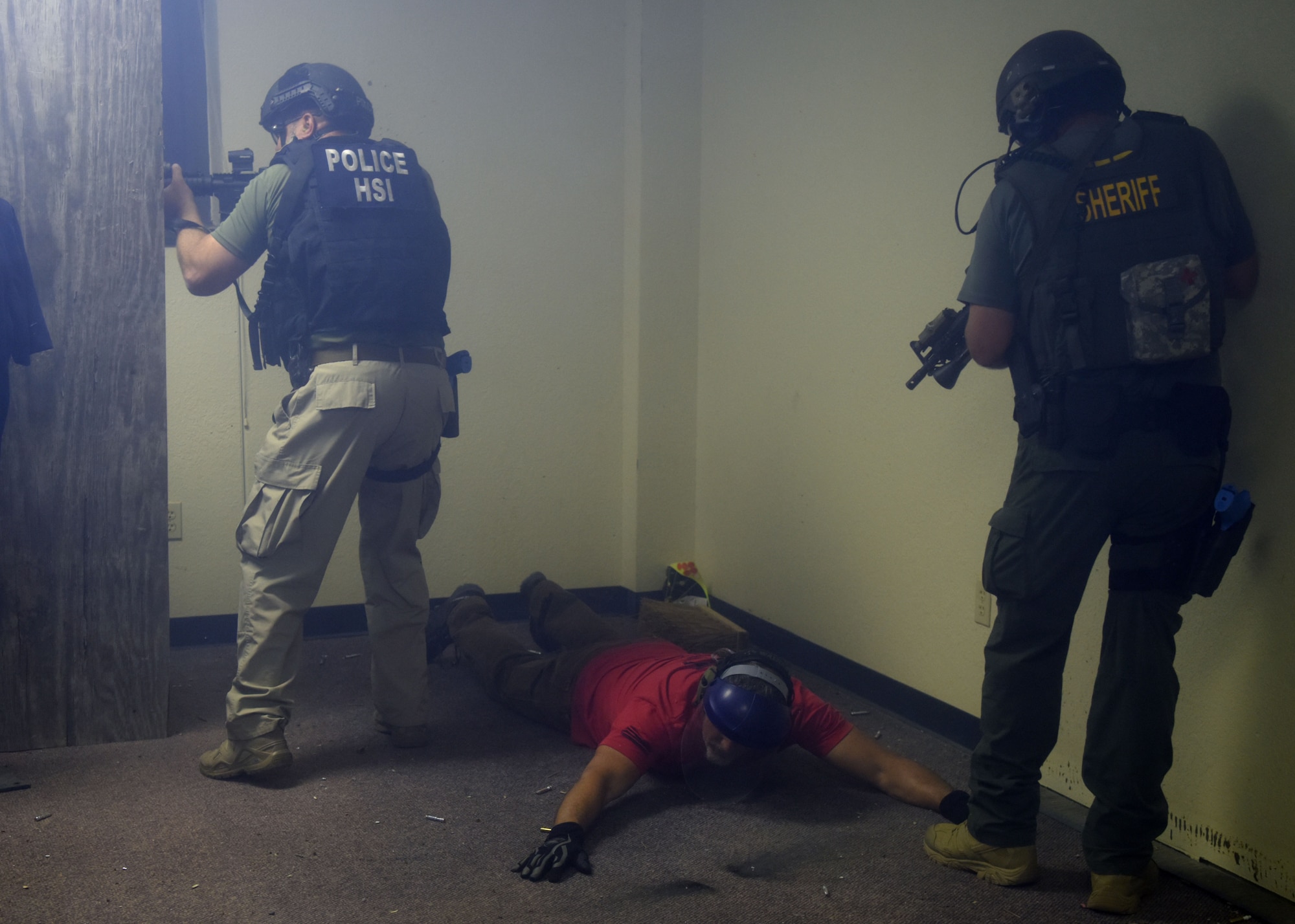 A joint operations team subdues a cadre with The Shooting Institute while clearing a room during close-quarters battle training on Eldorado Air Force Station, Texas, Oct. 9, 2020. The teams stepped out of their comfort zone and worked with teams from other services as they would in a real-life situation. (U.S. Air Force photo by Airman 1st Class Ethan Sherwood)