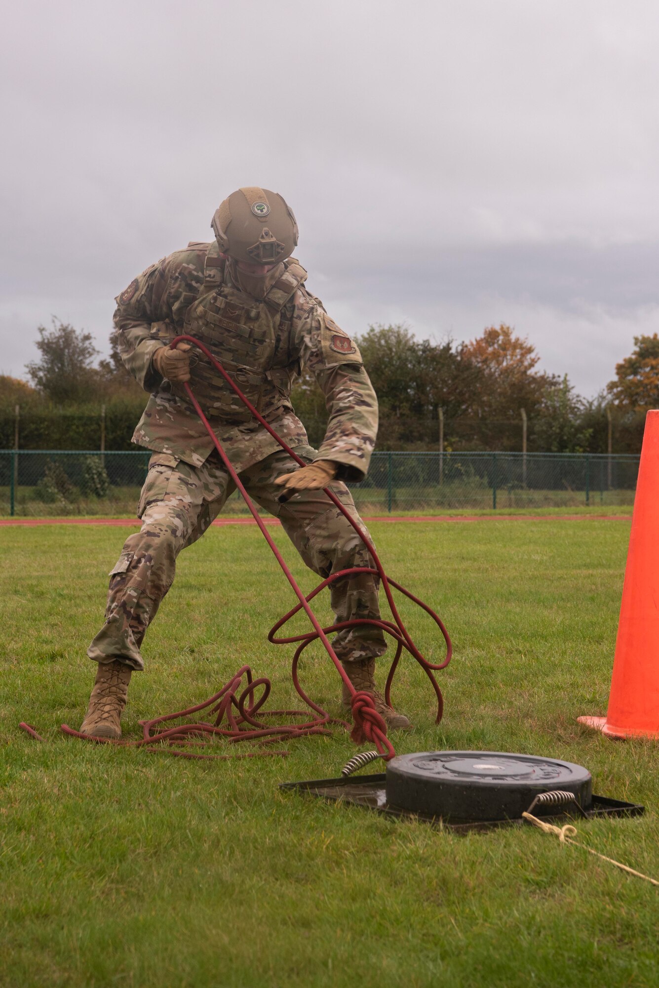 U.S. Air Force Airman 1st Class Adam Weigum, 100th Security Forces Squadron response force member, pulls a weighted sled during the fire muster competition at Royal Air Force Mildenhall, England, Oct. 8, 2020. The fire muster consisted of physical challenges and was held to increase fire prevention awareness. (U.S. Air Force photo by Airman 1st Class Joseph Barron)