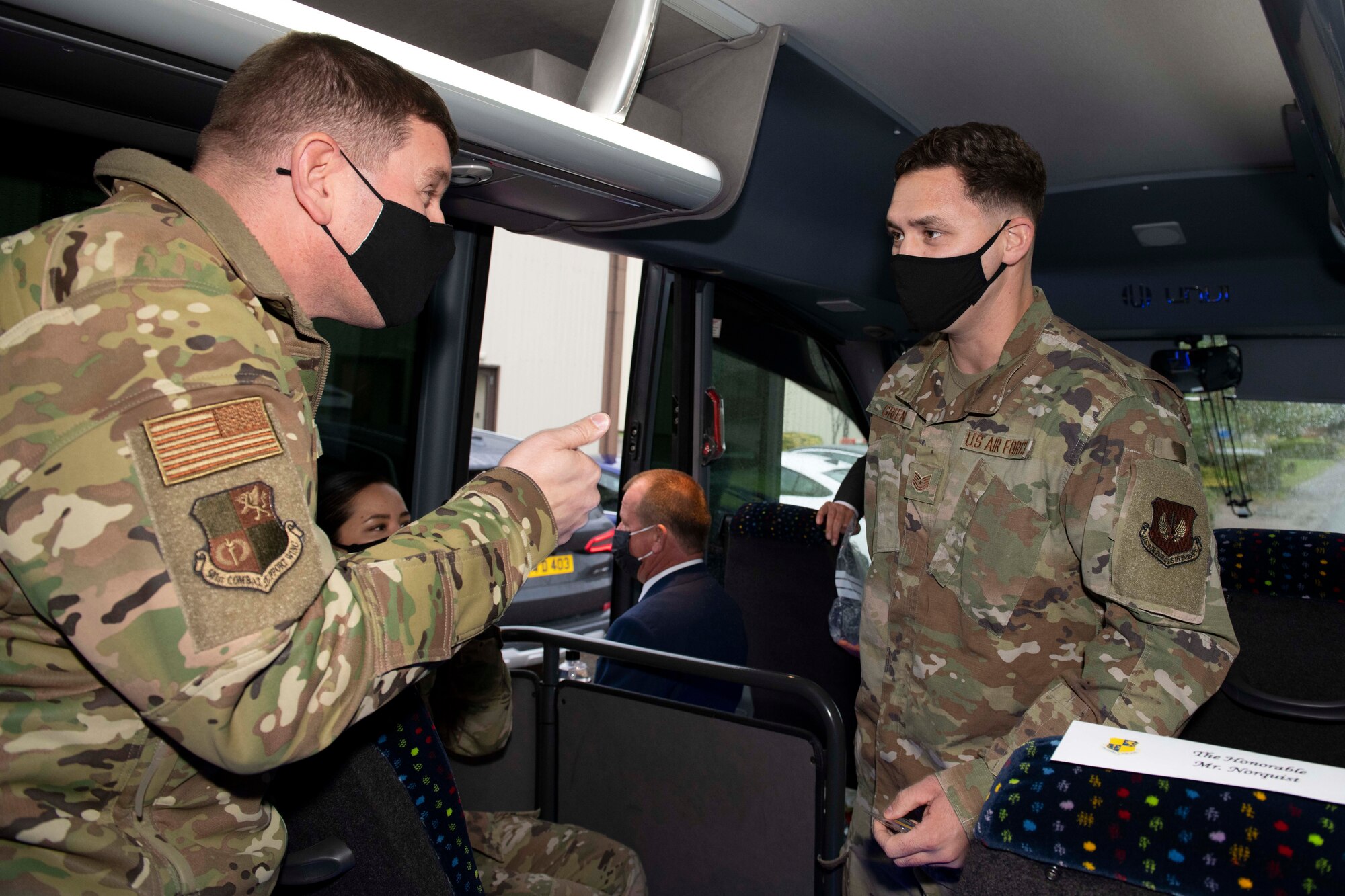 U.S. Air Force Col. Kurt Wendt, left, 501st Combat Support Wing commander, recognizes Tech. Sgt. Houston Greene, right, 420th Air Base Squadron flight chief of sustainment, with a coin of excellence at RAF Fairford, England, Oct. 12, 2020, during a visit by Deputy Secretary of Defense David L. Norquist. Greene was recognized for leading a $2 million dining facility renovation at RAF Fairford in support of Bomber Task Force Europe 2020. (U.S. Air Force photo by Senior Airman Jennifer Zima)