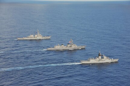 SOUTH CHINA SEA (Oct. 20, 2020) - The Arleigh Burke-class guided-missile destroyer USS John S. McCain (DDG 56) (rear), Japanese Maritime Self-Defense Force (JMSDF) ship JS Kirisame (DD 104) (middle), and Royal Australian Navy ship HMAS Arunta (FFH 151) (front) sail together in the South China Sea during multinational exercises. These exercises marked the fifth time of 2020 that Australia, Japan, and the U.S. have conducted operations together in the 7th Fleet area of operations.