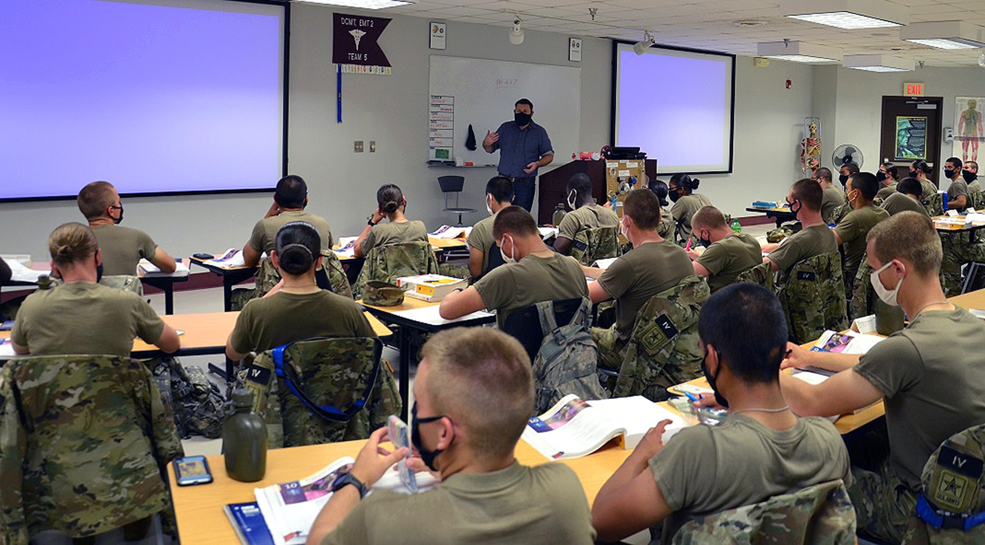 James Stilley, a civilian emergency medical technician instructor in the Combat Medic Specialist Training Program, or CMSTP, lectures students assigned to the second training shift of the day.