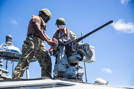 Sailors assigned to Commander, Task Force 75 aboard Patrol Boat (PB) Mk VI prepare to fire a Browning M2 .50 Caliber machine gun during maritime operations.