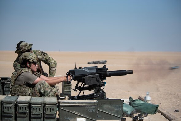 U.S. Army Soldiers, U.S. Air Force Airmen and Canadian Armed Forces members pose for a photo at the Udairi Range Complex, Kuwait, Oct. 12, 2020.