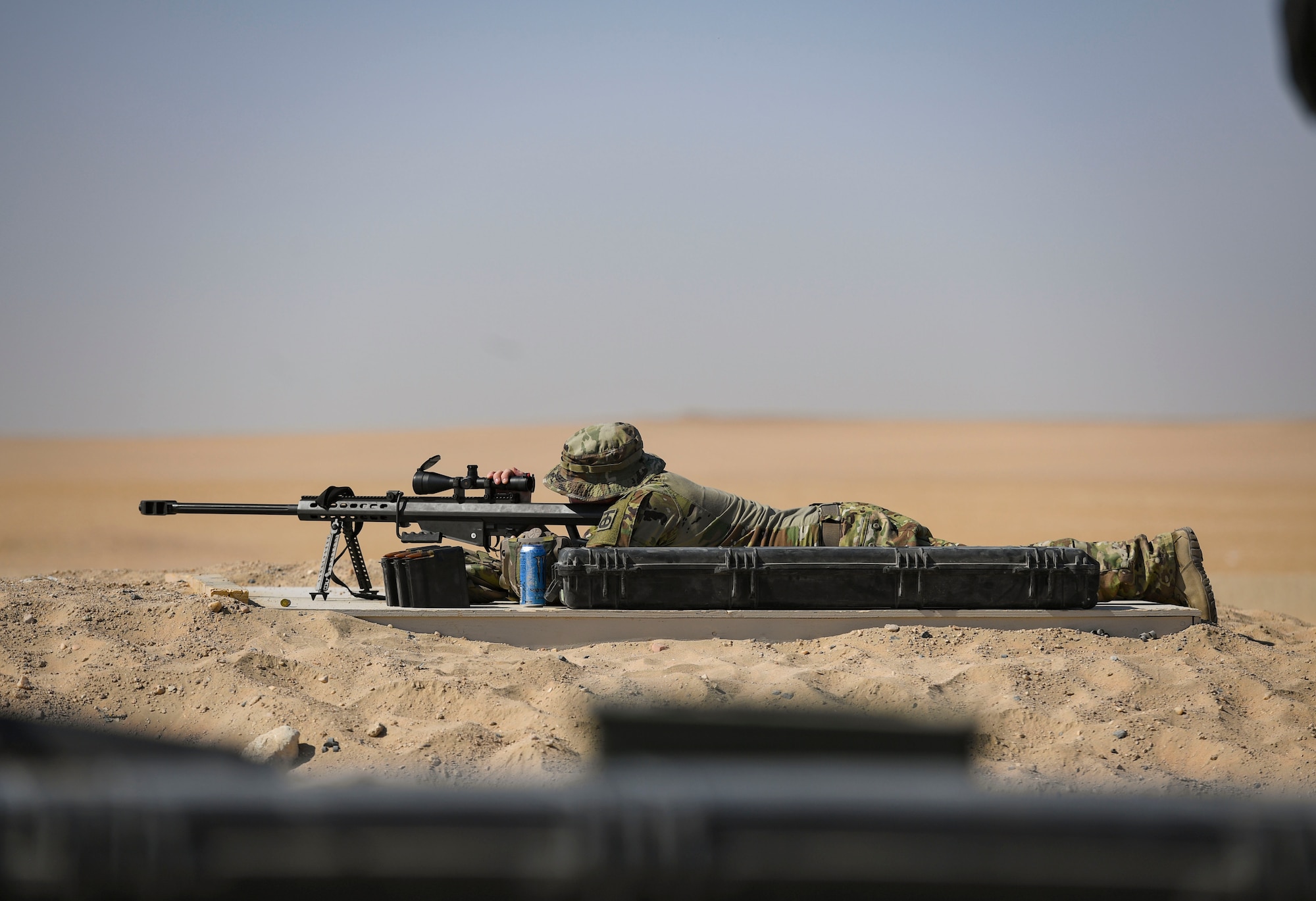 A U.S. Army Soldier fires a Barrett .50-caliber rifle at the Udairi Range Complex, Kuwait, Oct. 12, 2020.