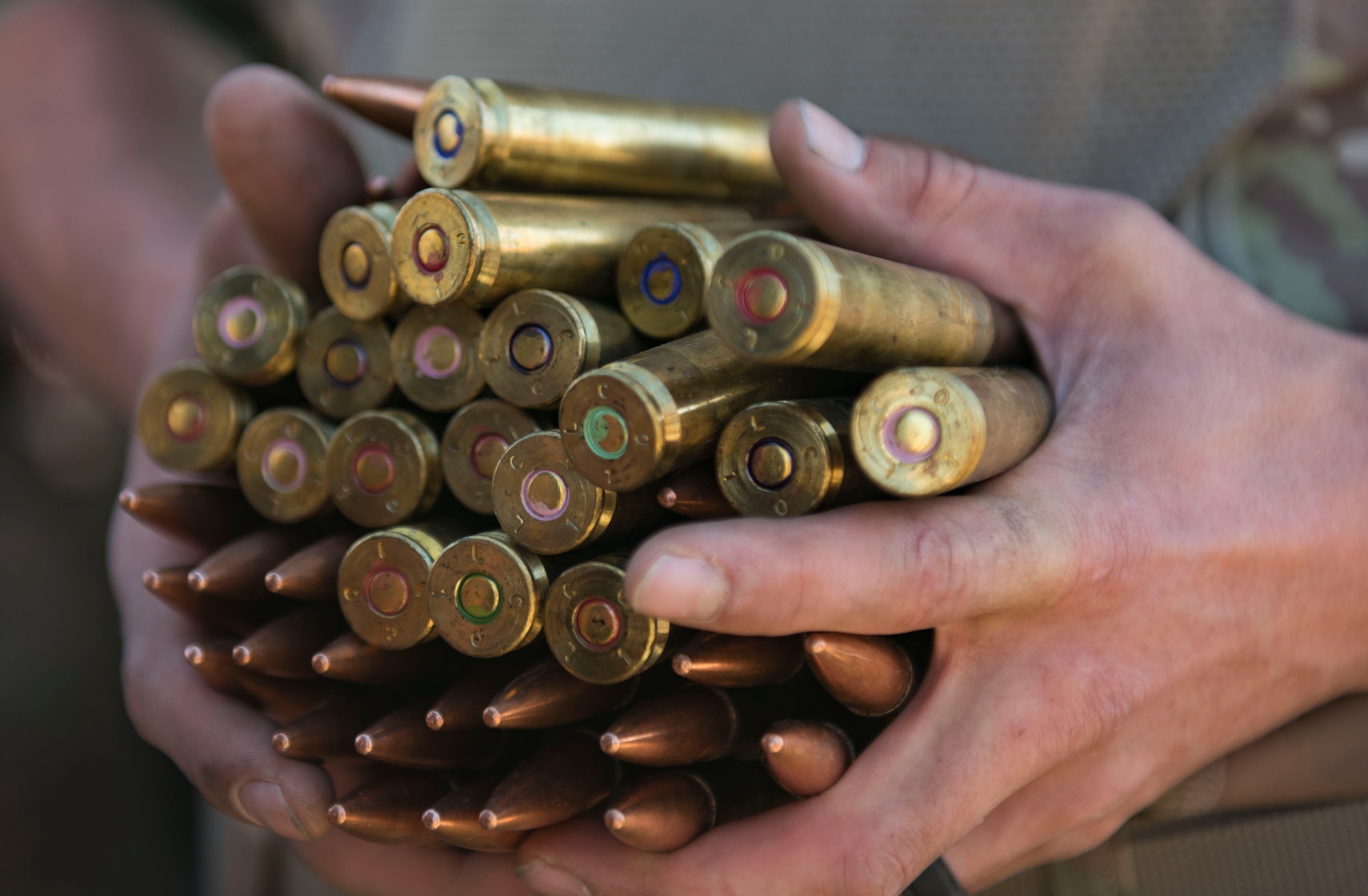A firing range participant holds .50 caliber ammunition at the Udairi Range Complex, Kuwait, Oct. 12, 2020.