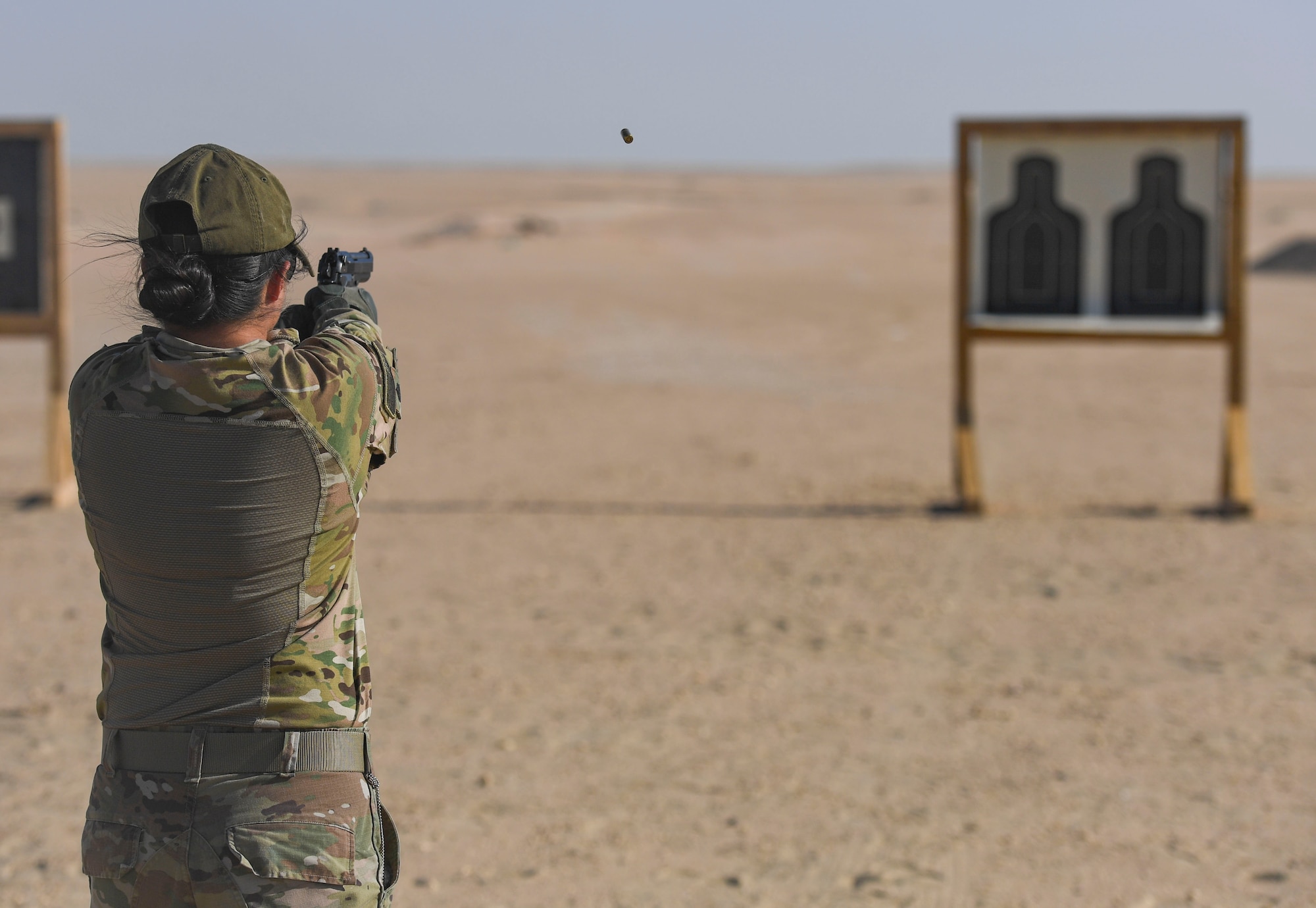 A U.S. Army Soldier fires a Beretta M-9 pistol at the Udairi Range Complex, Kuwait, Oct. 12, 2020.