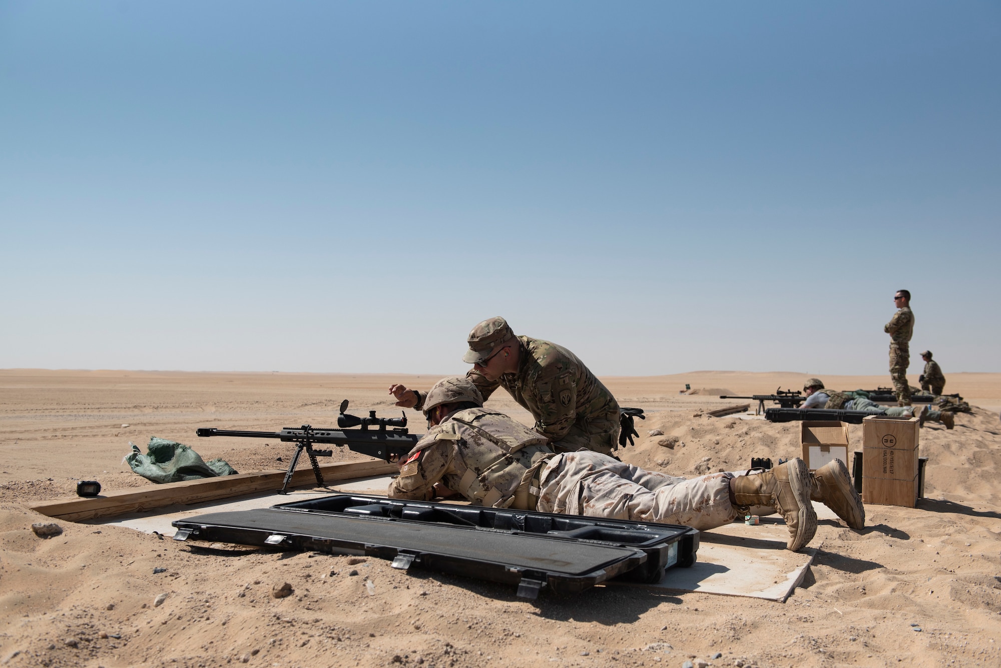 A Canadian Armed Forces member fires a Barrett .50-caliber rifle at the Udairi Range Complex, Kuwait, Oct. 12, 2020.