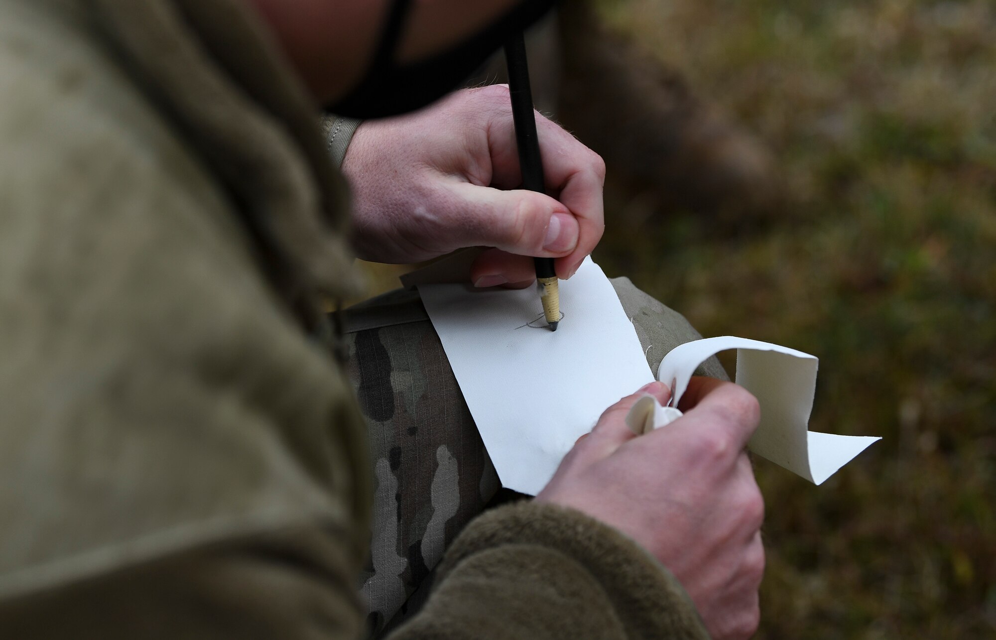U.S. Air Force Staff Sgt. Brandon Johnson, 31st Force Support Squadron dining facility assistant manager, labels a card during search and recovery training at Aviano Air Base, Italy, Oct. 15, 2020. The 31st FSS conducted annual search and recovery training to certify 23 newly-appointed search and recovery members. (U.S. Air Force photo by Staff Sgt. Savannah L. Waters)