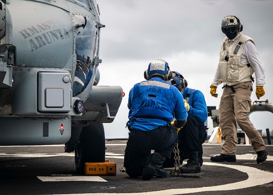 The U.S., JMSDF, and Royal Australian Navy conduct trilateral exercises in the South China Sea.