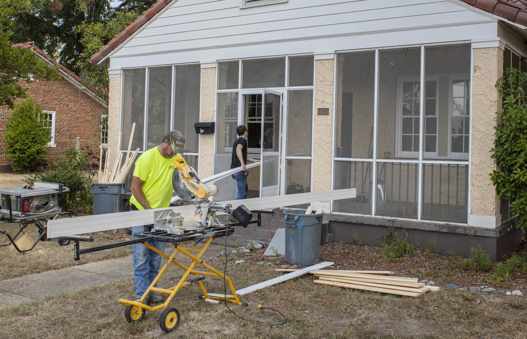 Workers install new windows at one of the historic homes on Fort Benning, Georgia, Oct. 1, 2020. Modifications to these homes are part of a broader effort underway to eliminate lead-based paint hazards in these facilities.