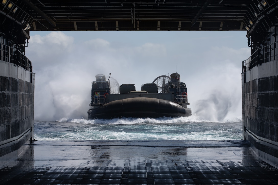 A U.S. Navy Landing Craft maneuvers into the well deck of the amphibious transport dock ship USS Somerset (LPD 25) during in-stream onload operations, Oct. 10.
