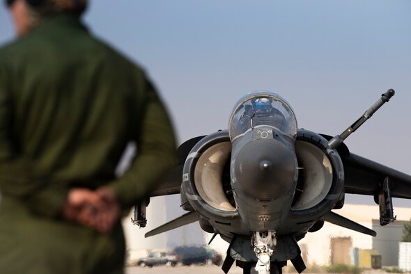 A U.S. Marine with Marine Attack Squadron 542, inspects a chock on an AV-8B II Harrier, at Mountain Home Air Force Base, Idaho, Oct. 8, 2020. VMA 542 and Marine Wing Support Squadron 271 worked closely with 366th Logistics Readiness Squadron fuels flight and provided aviation fuel, heavy equipment and utilities support for exercise Mountain Tiger. (U.S Air Force photo by Airman 1st Class Natalie Rubenak)