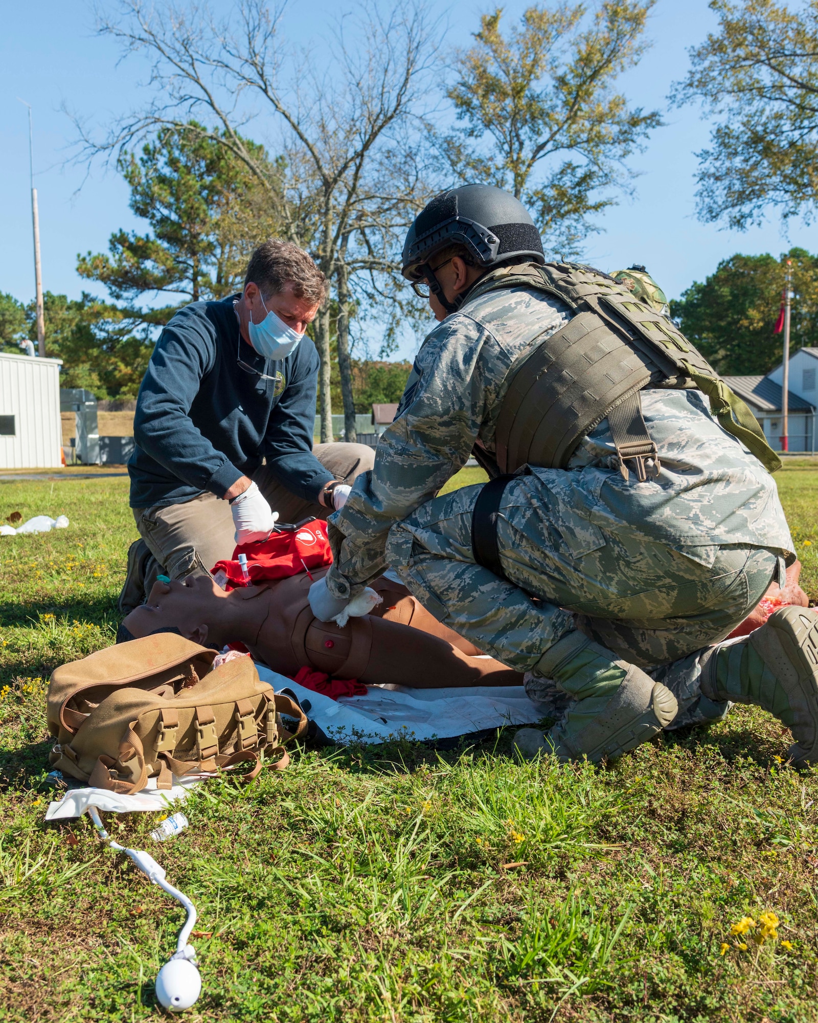 Total Force medical personnel from Little Rock Air Force Base, Ark., treat a wounded training mannequin during the Tactical Combat Casualty Care Course final exam on base, Oct. 16, 2020. Fifteen medics from Air Force active duty, Reserve and Guard units completed the course, which was facilitated by the 19th Medical Group, local Metropolitan Emergency Medical Services and supported by Air National Guard security forces members. The training prepares medical professionals to perform in an austere combat environment. (U.S. Air Force Reserve photo by Maj. Ashley Walker)