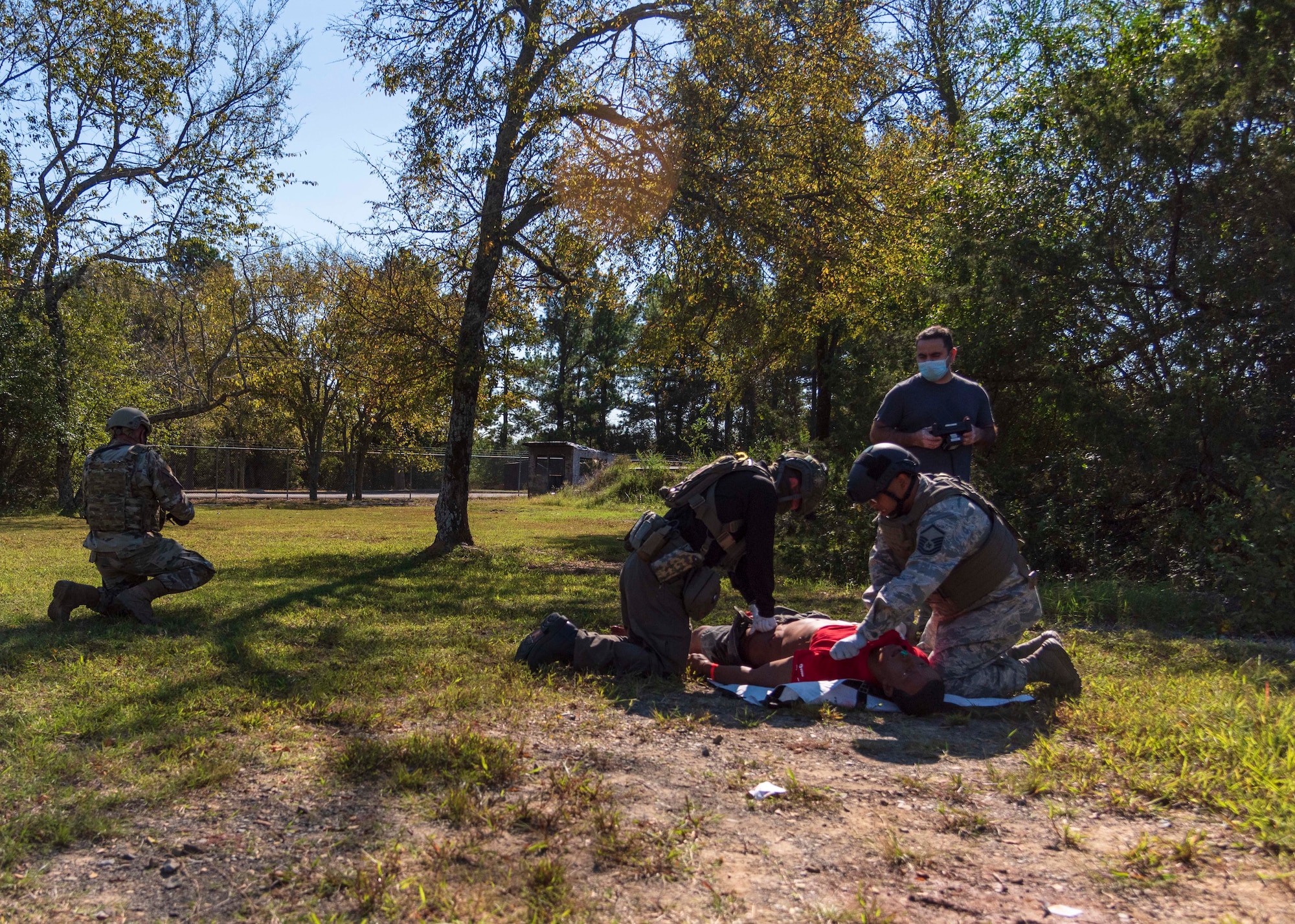 Total Force medical personnel from Little Rock Air Force Base, Ark., treat a wounded training mannequin during the Tactical Combat Casualty Care Course final exam on base, Oct. 16, 2020. Fifteen medics from Air Force active duty, Reserve and Guard units completed the course, which was facilitated by the 19th Medical Group, local Metropolitan Emergency Medical Services and supported by Air National Guard security forces members. The training prepares medical professionals to perform in an austere combat environment. (U.S. Air Force Reserve photo by Maj. Ashley Walker)