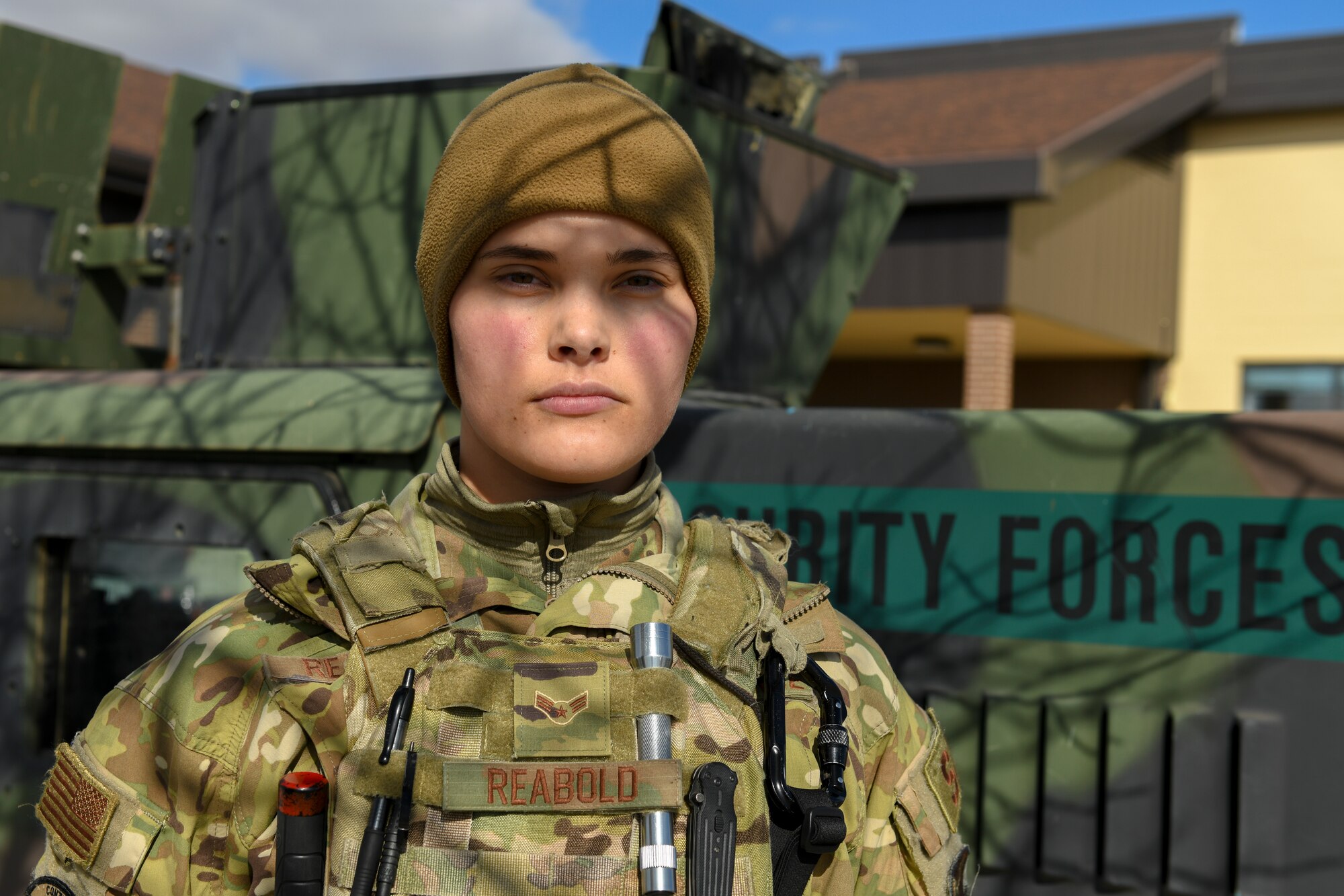 Airman 1st Class Lauryn Reabold, 5th Security Forces Squadron defender, poses for a portrait on Oct. 19, 2020 at Minot Air Force Base, North Dakota. Reabold operates the .240 Echo machine gun out of the Humvee turret on the lead convoy as she and her fellow defenders scout the road and inestigate the avenues of appoach. (U.S. Air Force photo by Airman 1st Class Josh W. Strickland)