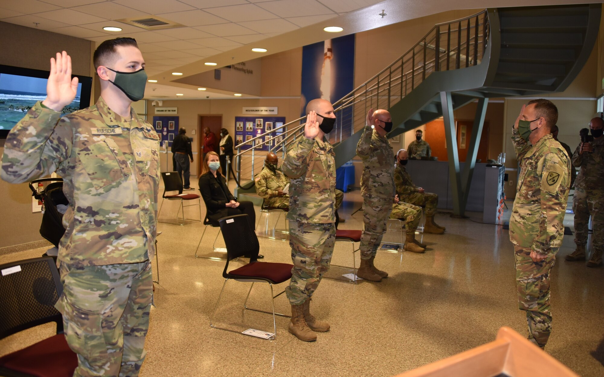 Air Force enlisted personnel are administered the oath of enlistment as they transfer to the Space Force.