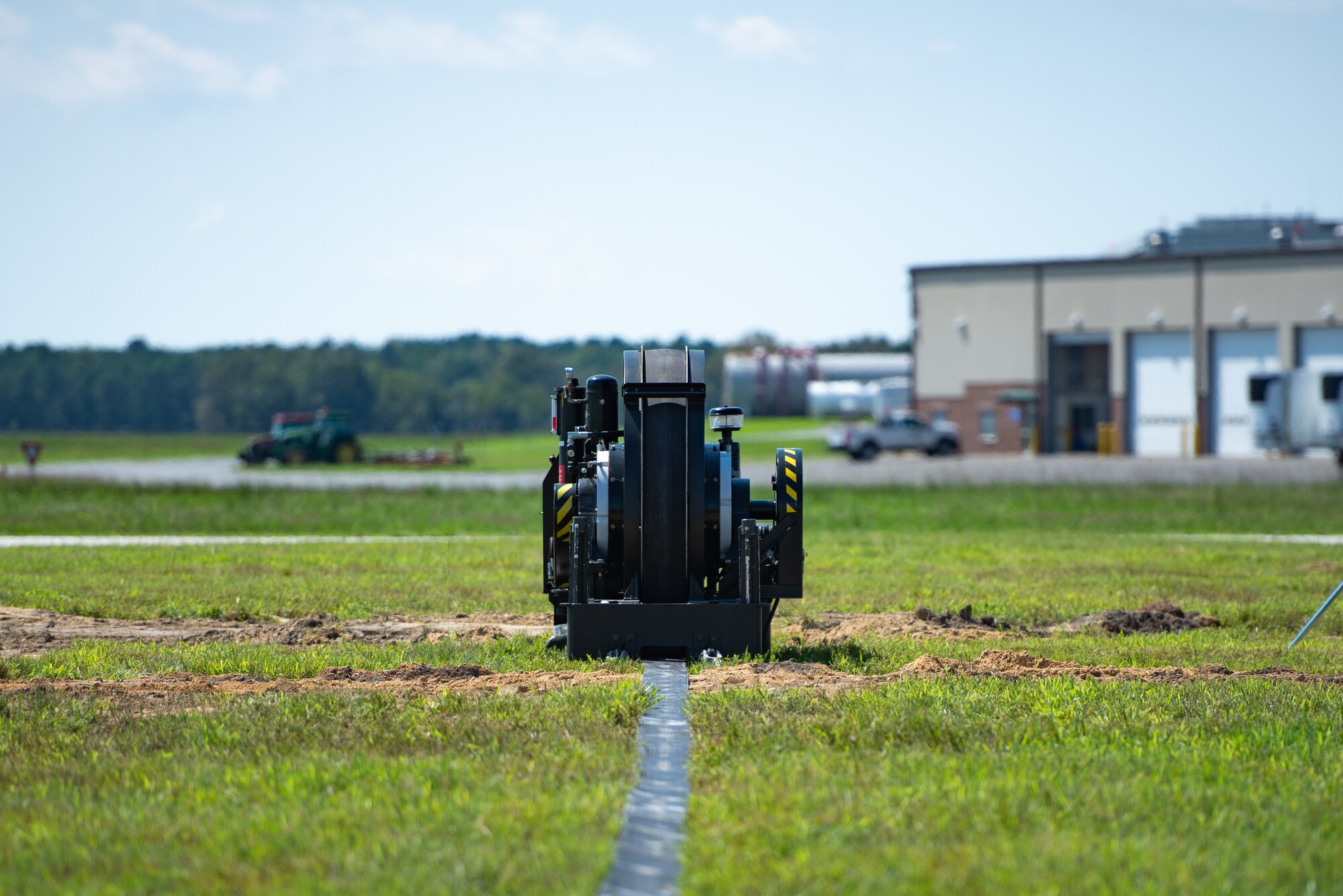 A photo of a mobile arrestor system sitting on the airfield at the 177th Fighter Wing.