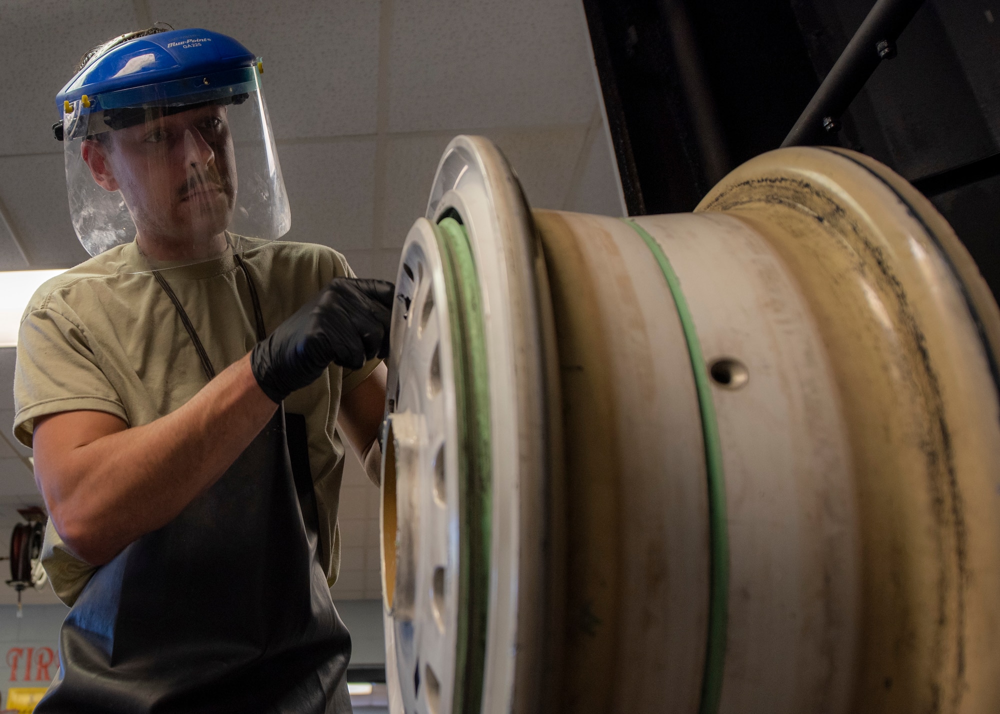 Senior Airman Lyman Patee, 4th Equipment Maintenance Squadron crash recovery wheel and tire craftsman, inspects and cleans the wheel of an F-15E Strike Eagle at Seymour Johnson Air Force Base, North Carolina, Oct. 14, 2020.