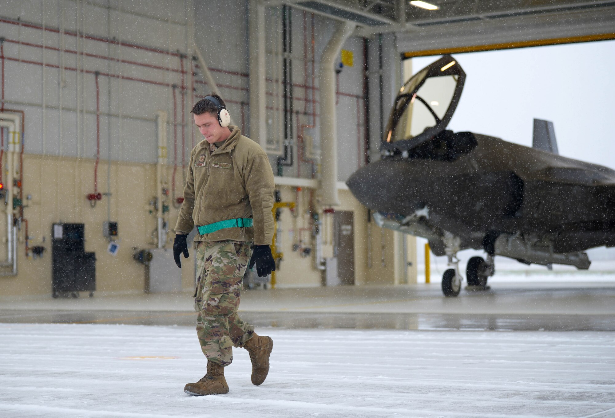 Tech. Sgt. Theodore Crowely, III, a 354th Aircraft Maintenance Squadron F-35A Lightning II dedicated crew chief, checks for debris prior to launch during RED FLAG-Alaska 21-1 on Eielson Air Force Base, Alaska, Oct. 19, 2020. RED FLAG-Alaska exercises are focused on improving the combat readiness of the U.S. and international forces and providing for units preparing for air and space expeditionary force taskings. (U.S. Air Force photo by Senior Airman Beaux Hebert)