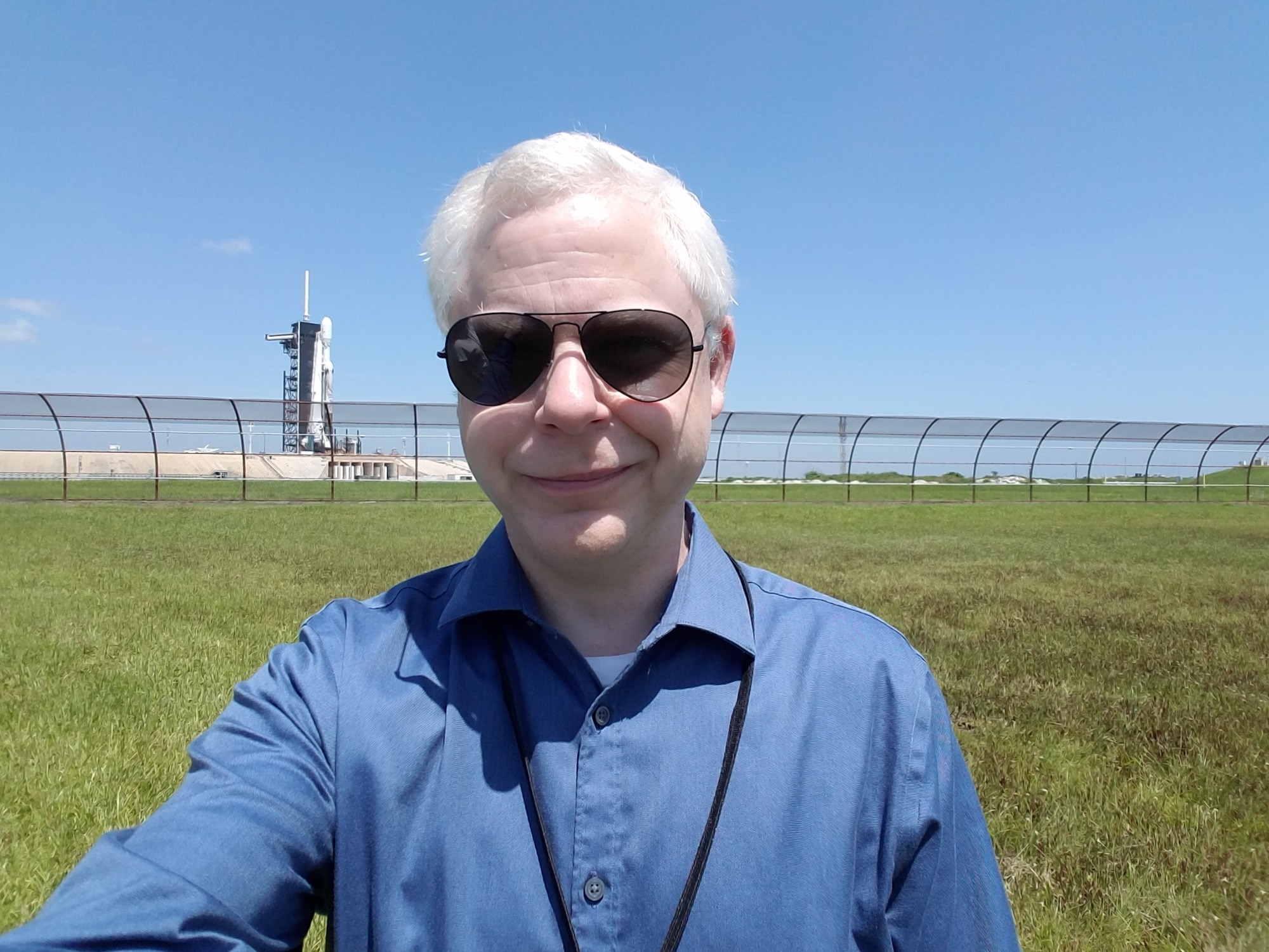 Air Force Research Laboratory senior engineer Dr. Michael Starks standing in front of the SpaceX Falcon Heavy rocket that carried AFRL’s Demonstration and Science Experiments (DSX) satellite into orbit on Jun. 25, 2019. DSX was designed and built at AFRL, and is successfully conducting new research to advance understanding of the Van Allen radiation belts and their effect on spacecraft components. (Courtesy photo)