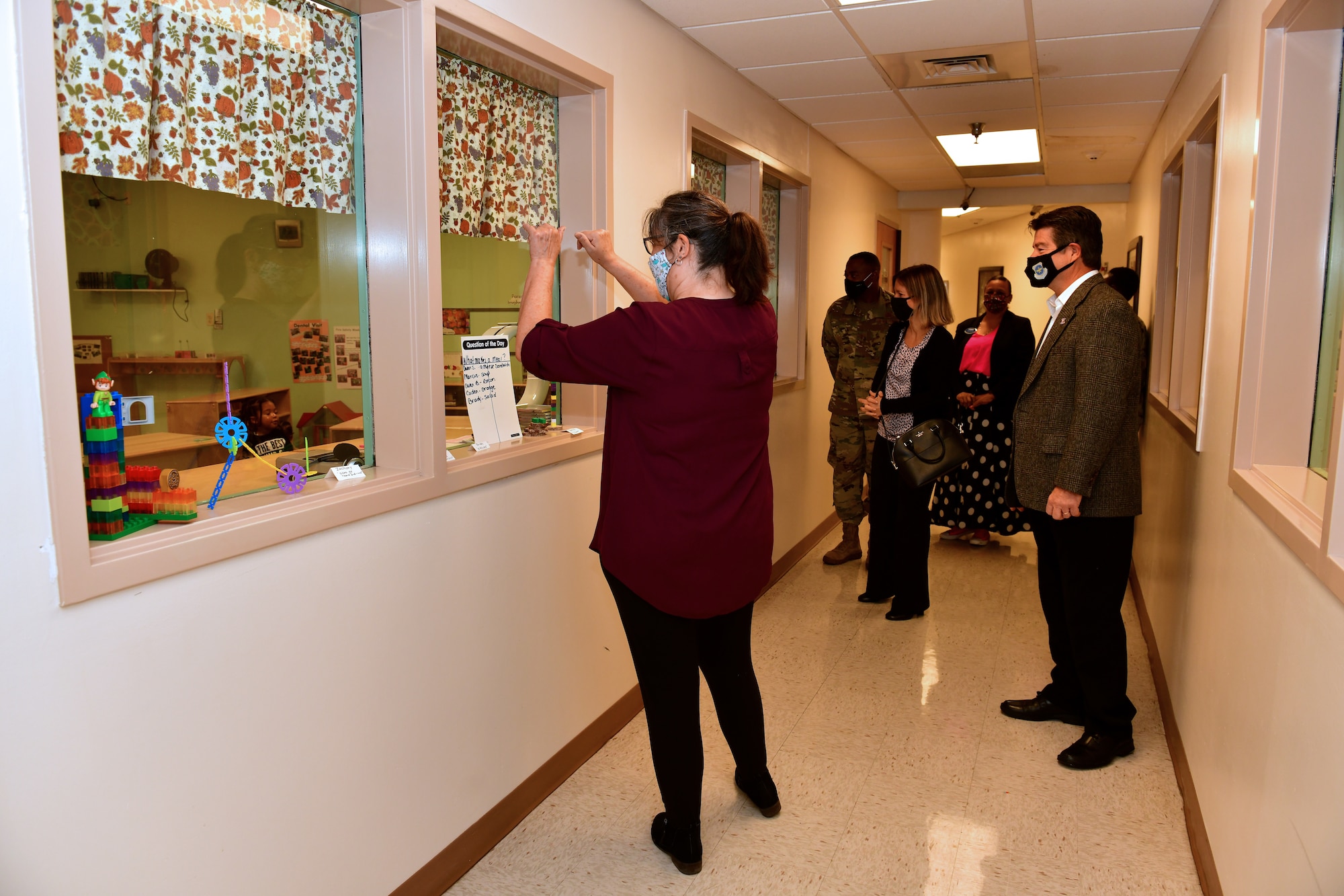 Man being shown child care facilities