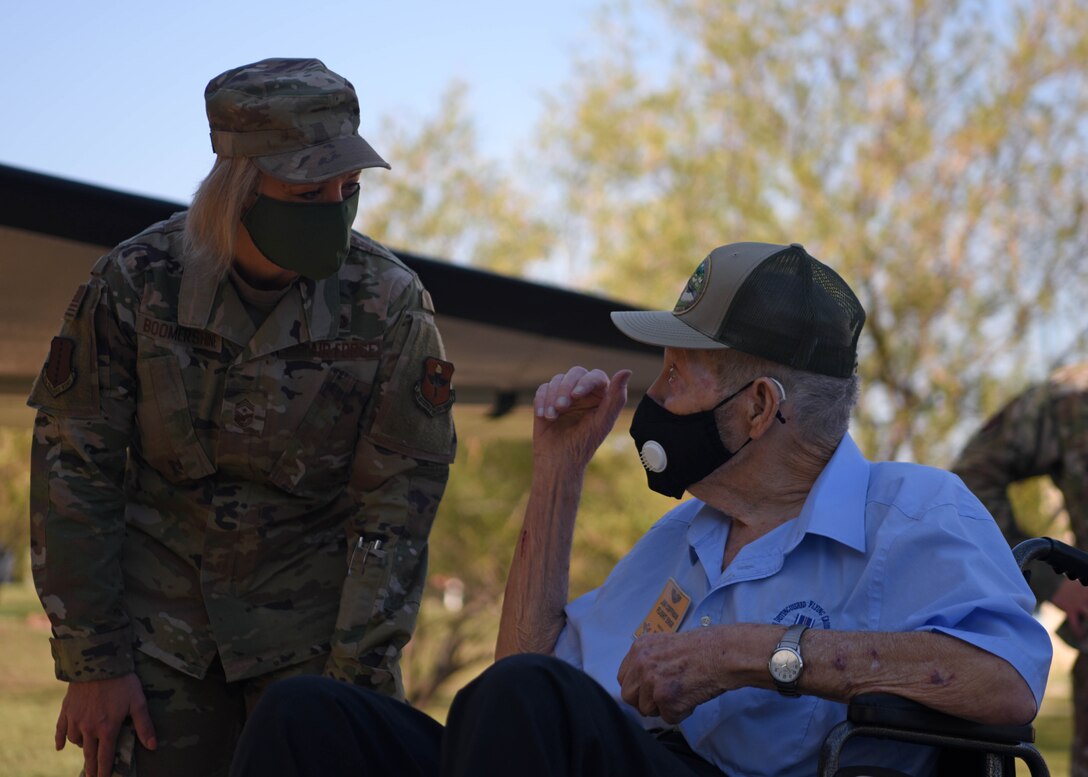 U.S. Air Force Chief Master Sgt. Casy Boomershine, 17th Training Wing command chief, discusses Ret. Master Sgt. Jim Coffman, former EC-47 flight engineer’s career in front of the EC-47 Memorial on Goodfellow Air Force Base, Texas, Oct. 13, 2020. Coffman served during the vietnam war flying multiple top secret missions over Southeast Asia. (U.S. Air Force photo by Airman 1st Class Ethan Sherwood)
