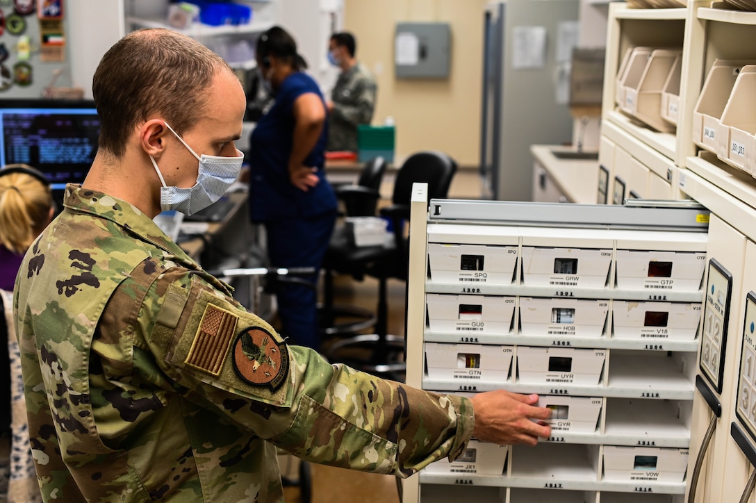 U.S. Air Force 2nd Lt. Ian Kline, 14th Medical Group lieutenant casual, grabs a prescription for a patient on Oct. 19, 2020, at Columbus Air Force Base, Miss. Kline will be working at the Columbus AFB Pharmacy Clinic until his class’s projected start date in Jan. of 2021. (U.S. Air Force photo by Airman 1st Class Davis Donaldson)