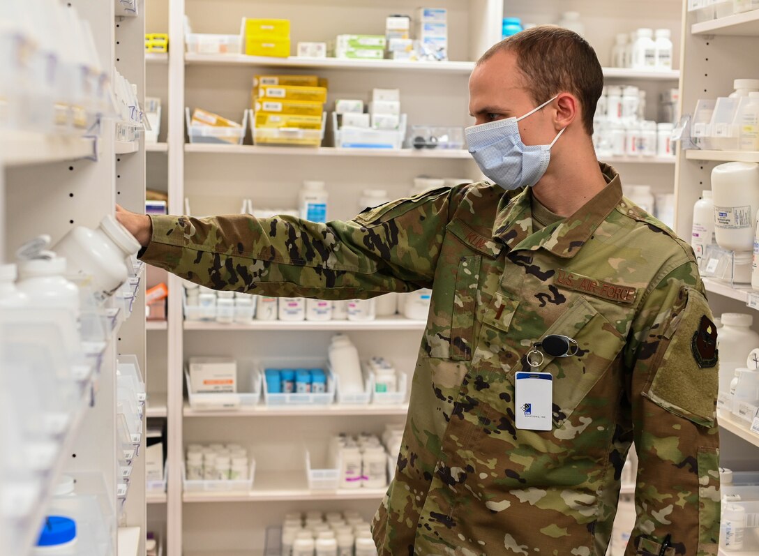 U.S. Air Force 2nd Lt. Ian Kline, 14th Medical Group lieutenant casual, sorts prescription medicines on Oct. 19, 2020, at Columbus Air Force Base, Miss.  Before joining the military, Kline accomplished a short term goal of becoming certified as a National Pharmacy Technician in 2016. (U.S. Air Force photo by Airman 1st Class Davis Donaldson)