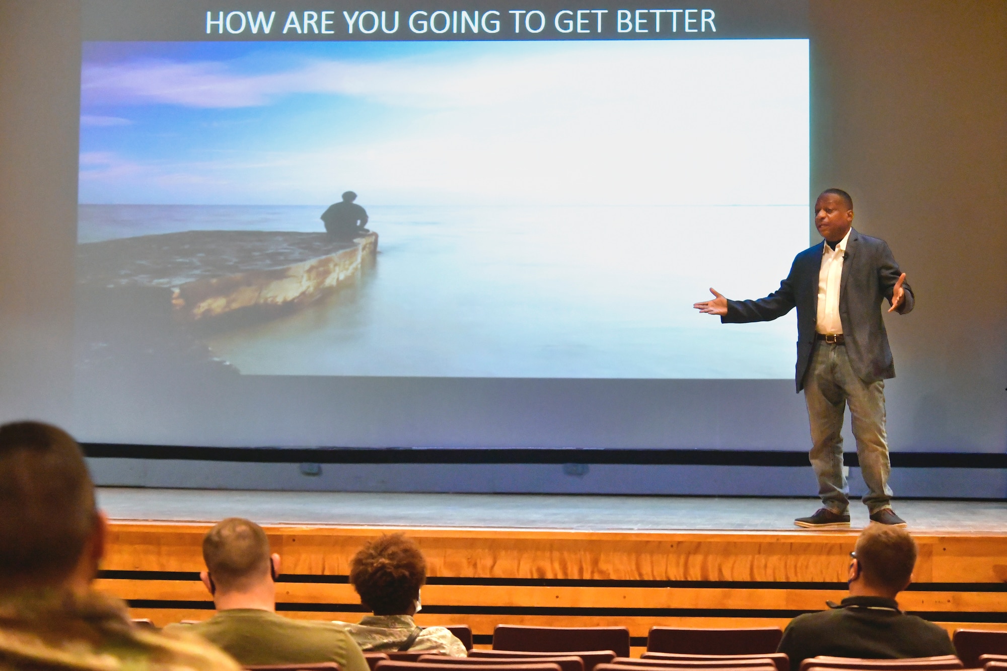 Retired Chief Master Sgt. Anthony Brinkley, leadership and resiliency coach, speaks to Team Hill Airmen on stage.