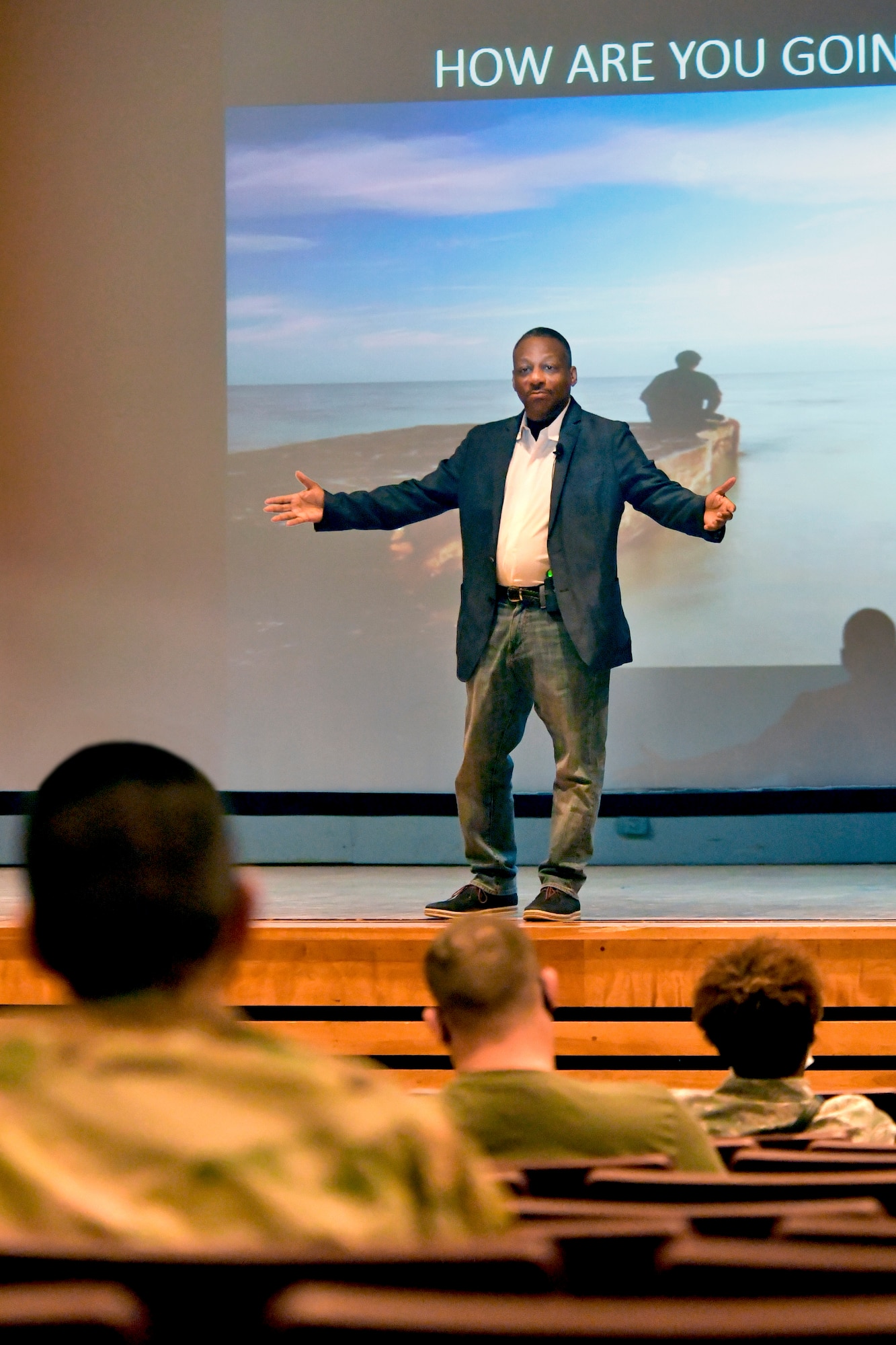 Retired Chief Master Sgt. Anthony Brinkley, leadership and resiliency coach, speaks to Team Hill Airmen on stage.