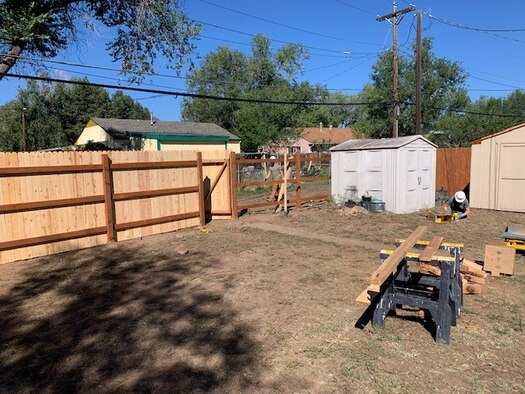 Members of the 50th Civil Engineer Squadron build a fence for an women in downtown Colorado Springs, Colorado, Sept. 5, 2020. The Airmen participate in one community involvement event per quarter and assisted Habitat for Humanity with the project. (Courtesy photo)