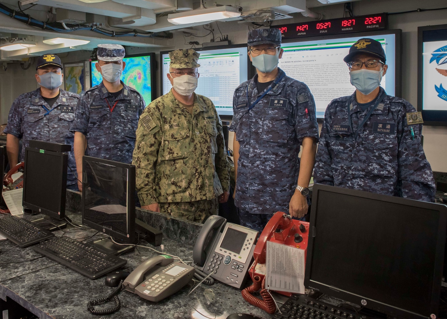 Vice Adm. Hideki Yuasa, commander in chief, Self Defense Fleet, Japan Maritime Self Defense Force, (center right) visits the Enforcement Coordination Cell (ECC) watch floor alongside members of his team and U.S. 7th Fleet ECC Director, Capt. James J. Mehail, during a visit to the 7th Fleet command ship, USS Blue Ridge (LCC 19). As the U.S. Navy’s largest forward-deployed fleet, there are roughly 50-70 ships and submarines, 150 aircraft, and approximately 20,000 Sailors operating in the 7th Fleet area of operations.
