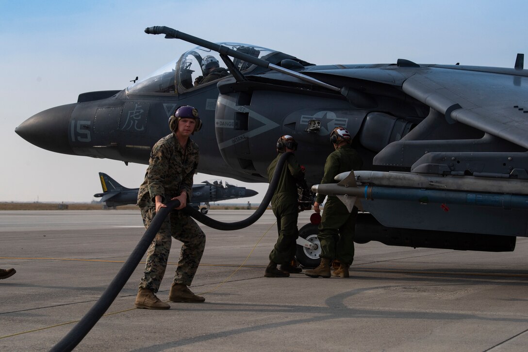 U.S. Marine power liners prepare to refuel an AV-8B II Harrier, at Mountain Home Air Force Base, Idaho, Oct. 8, 2020. Marine Attack Squadron 542 and Marine Wing Support Squadron 271 worked closely with 366th Logistics Readiness Squadron fuels flight and provided aviation fuel, heavy equipment and utilities support for exercise Mountain Tiger. (U.S Air Force photo by Airman 1st Class Natalie Rubenak)