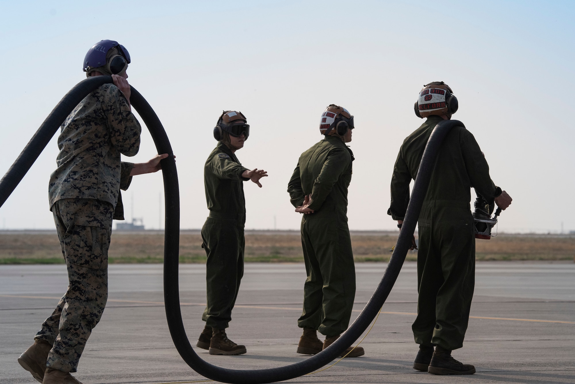 U.S. Marine power liners assigned to Marine Attack Squadron 542, prepare to refuel a AV-8B II Harrier, at Mountain Home Air Force Base, Idaho, Oct. 8, 2020. VMA 542 and Marine Wing Support Squadron 271 worked closely with 366th Logistics Readiness Squadron fuels flight and provided aviation fuel, heavy equipment and utilities support for exercise Mountain Tiger. (U.S Air Force photo by Airman 1st Class Natalie Rubenak)